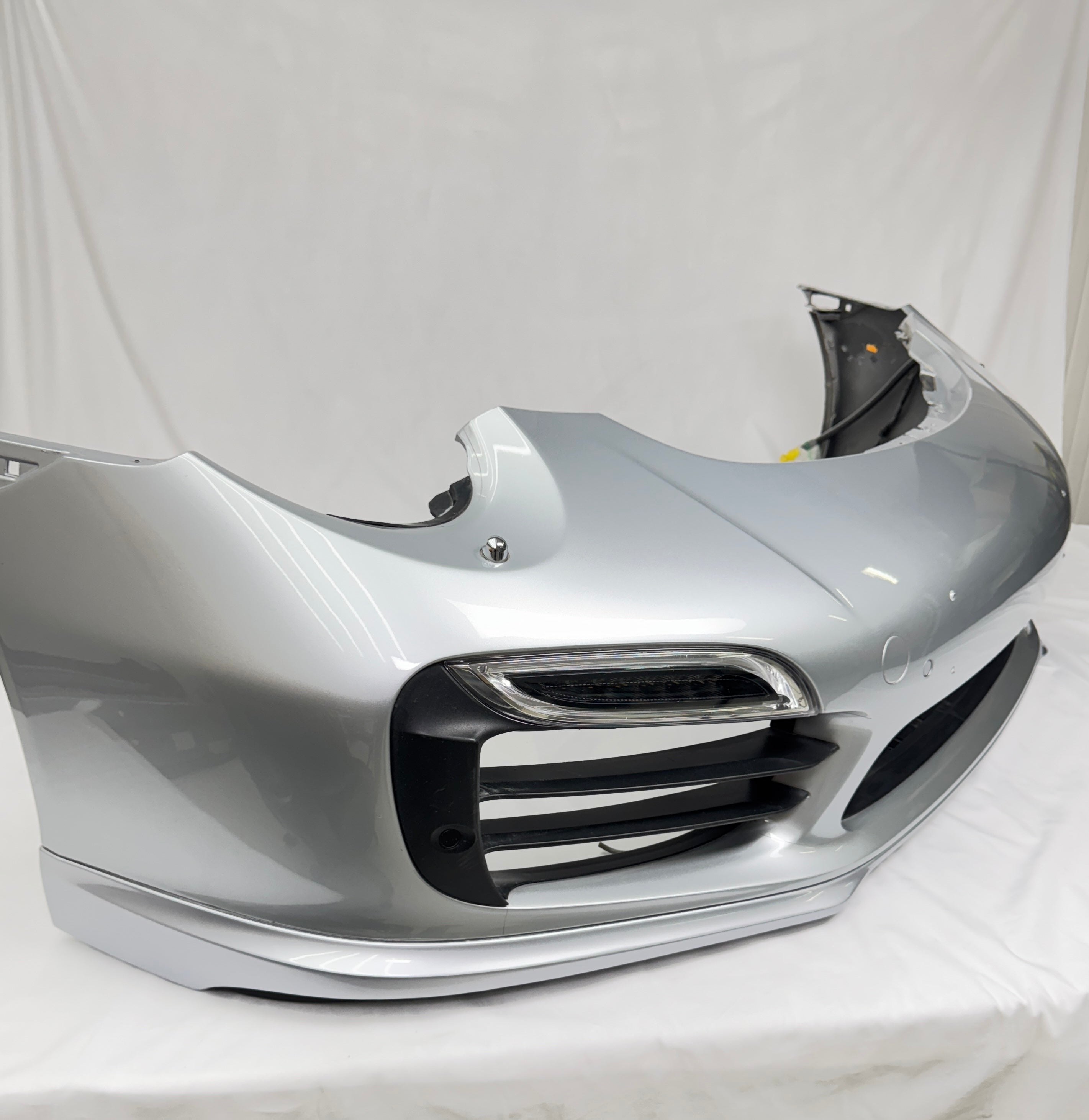 Porsche Factory OEM 991 Turbo front bumper with lights & grills in silver