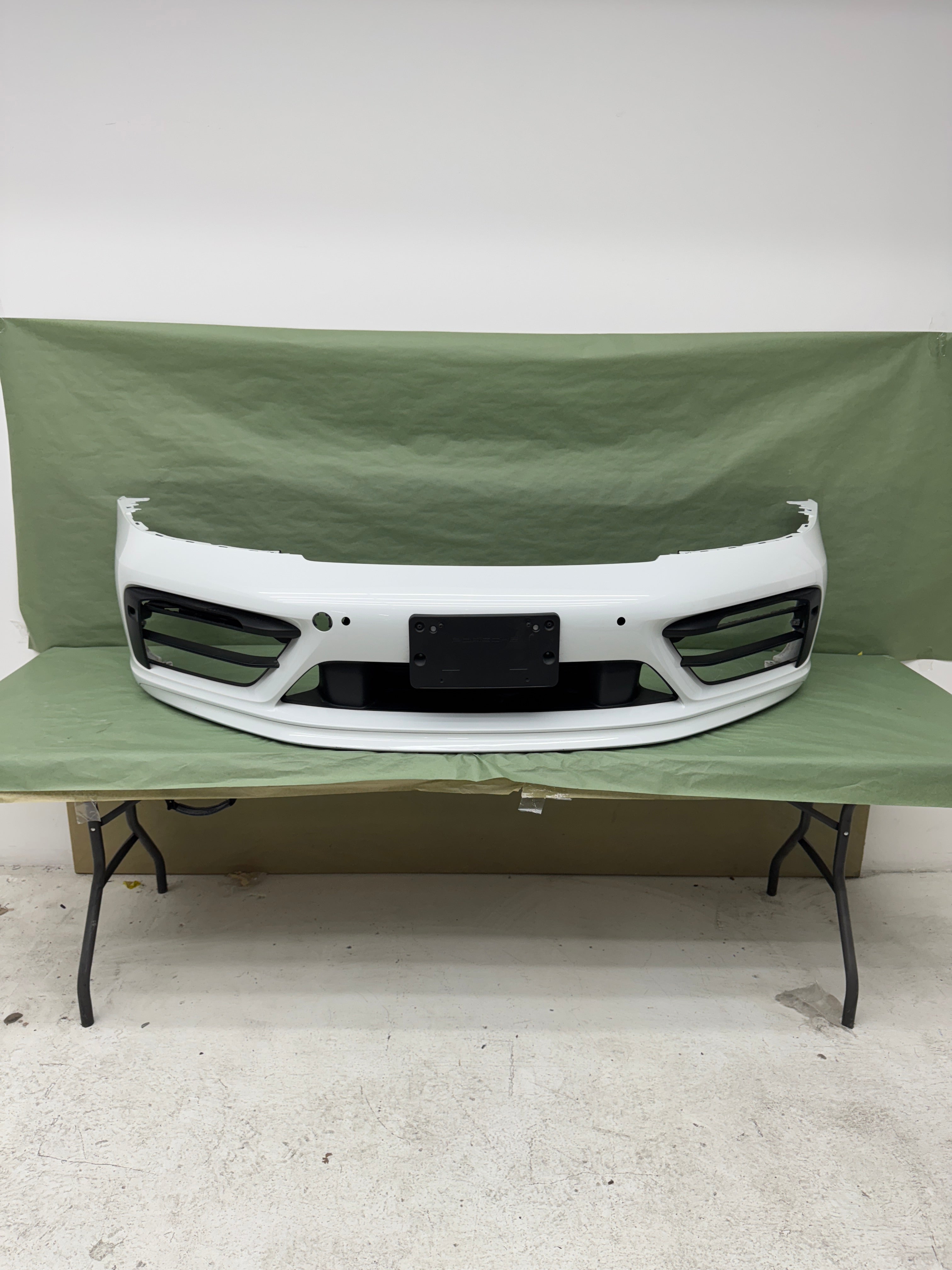 Porsche OEM Factory 992 GTS front bumper with spoiler and grills, in white