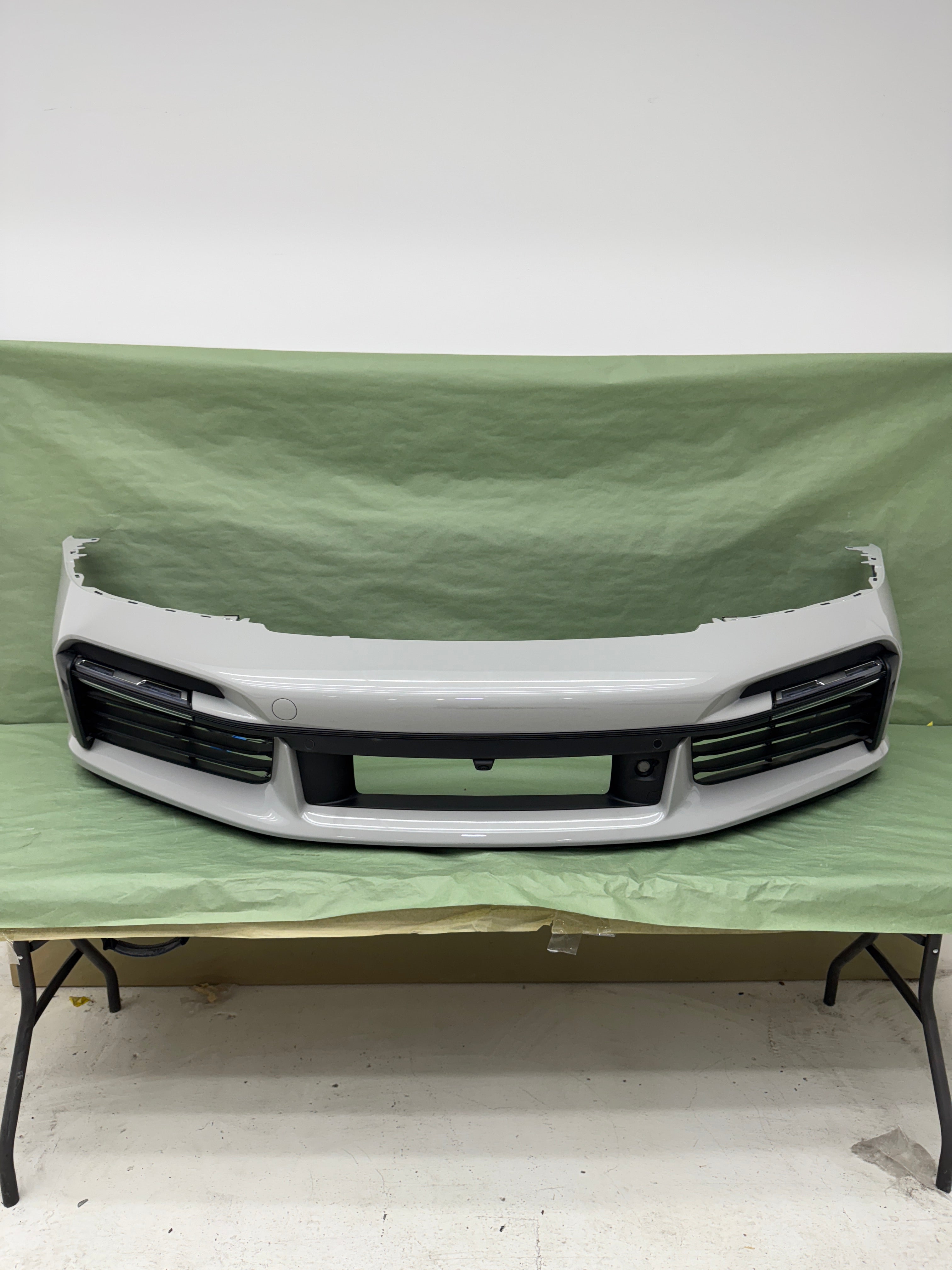 Porsche OEM Factory Turbo S front bumper, with limited attachments in chalk